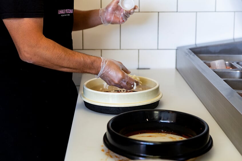 Making a pizza at Eagle Pizzas