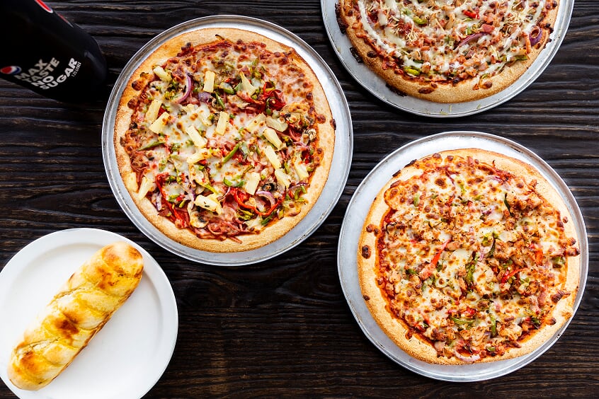 Pizzas and garlic bread